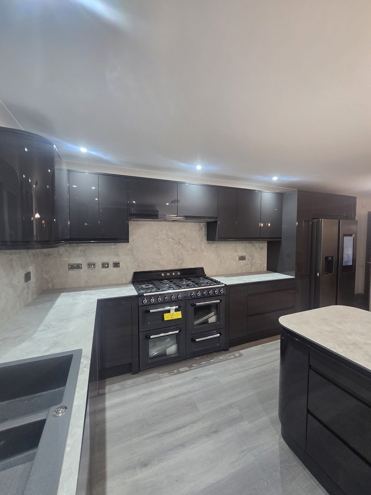 Finished anthracite gloss kitchen refurbishment with range cooker, London