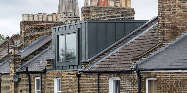 Zinc clad dormer loft conversion on a London brick terrace