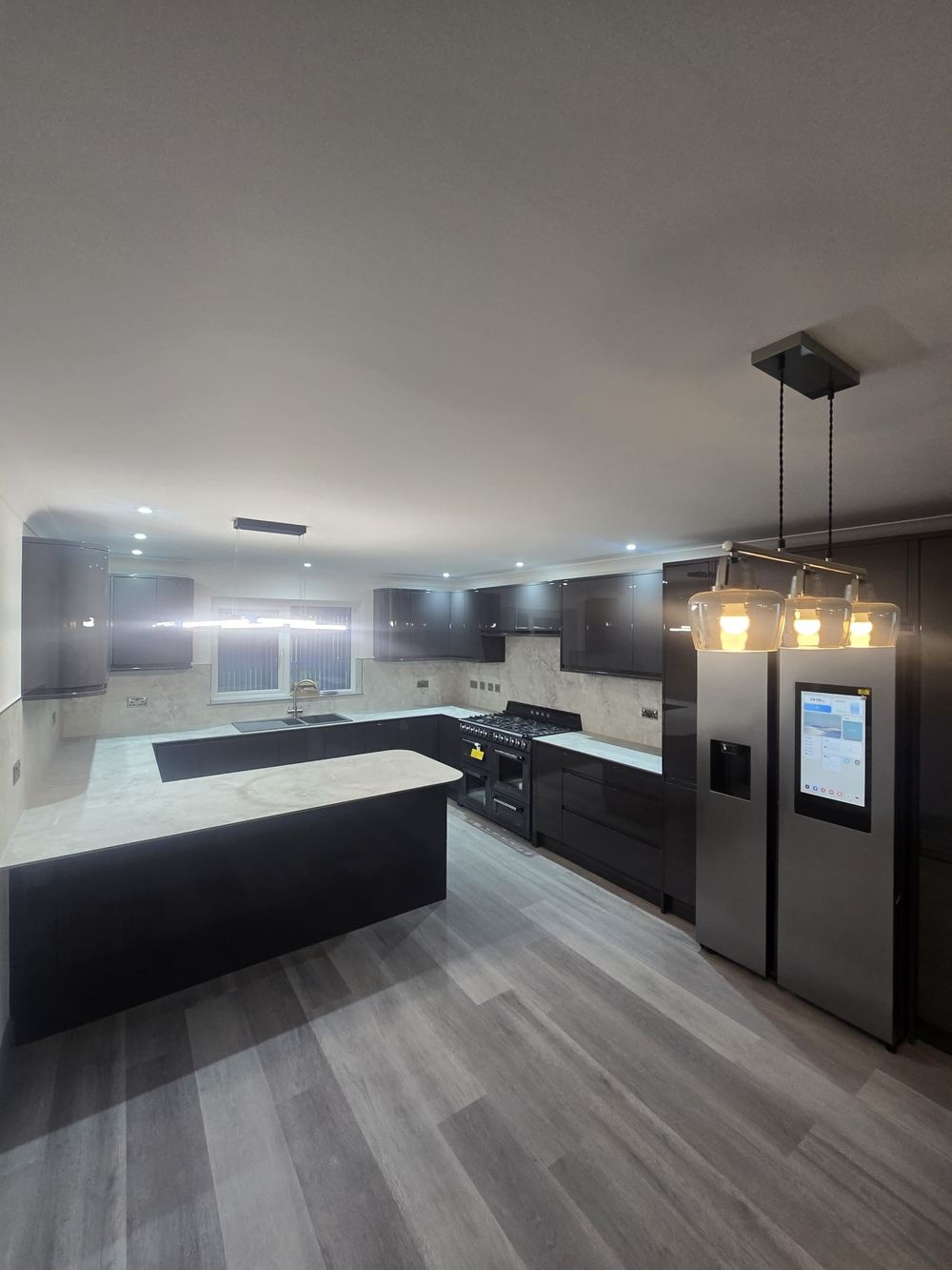 Anthracite gloss kitchen with island and pendant lighting